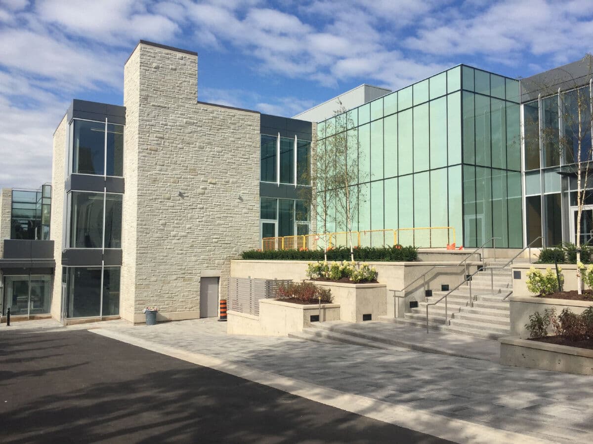 Daytime exterior view showing the glazed facade beside the entrance